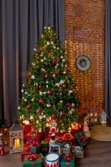 Fototapeta na wymiar Happy New Year and Christmas! New Year's interior in loft style, green Christmas tree and classic decorations