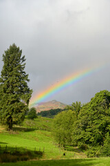 Naklejka premium A rainbow shining above the valley of Little Langdale, near Skelwith Bridge in the Lake District
