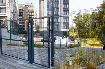 Front door of the courtyard. Remote control to open swing gate door by motor automation is home...