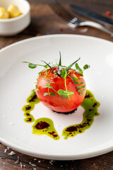 Tomato Caprese salad with mozzarella and micro sprouts