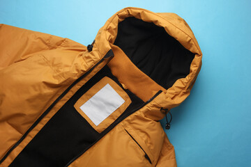 Yellow Winter down jacket on a blue background
