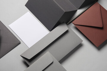 Floating envelopes and brochure, cards on gray background with shadow. Minimalism, modern business...