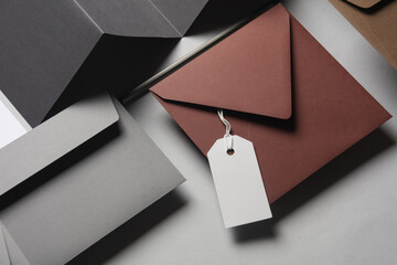 Floating envelopes and brochure, cards, tag on gray background with shadow. Minimalism, modern...