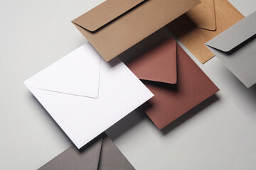 Floating envelopes on gray background with shadow. Minimalism, modern business still life, creative layout - obrazy, fototapety, plakaty