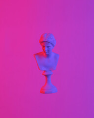 Venus bust floating in the air, isolated in blue-red neon gradient light. Levitating objects....