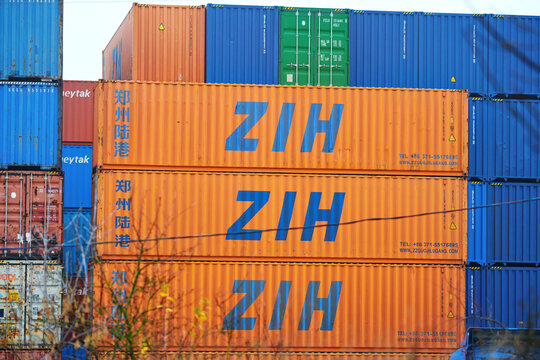 Minsk, Belarus. Nov 15, 2023. Cargo containers stacked at warehouse- ZIH Zzguojilugang. Zhengzhou International Hub. Stack of shipping containers at storage yard.
