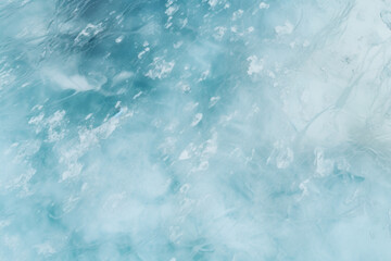 Abstract background of ice and cracks on the surface of frozen lake. View from above