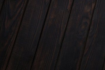 Dark brown wooden background, top view