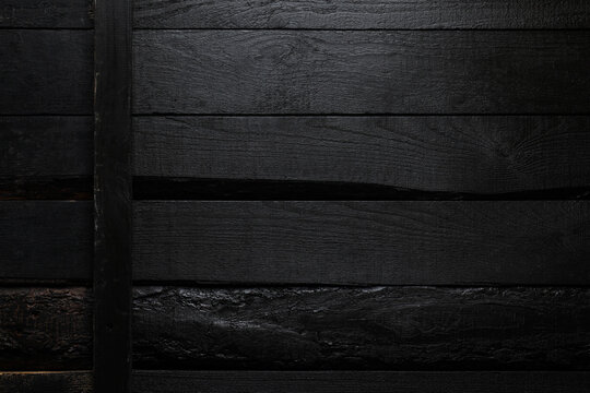 Black wooden background, top view