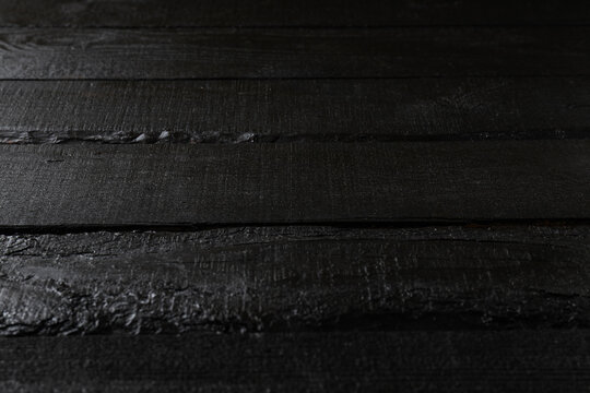 Black wooden background, close up