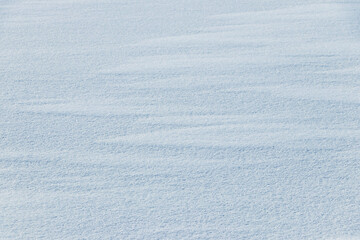 Snow texture. White surface of snow with clearly defined texture