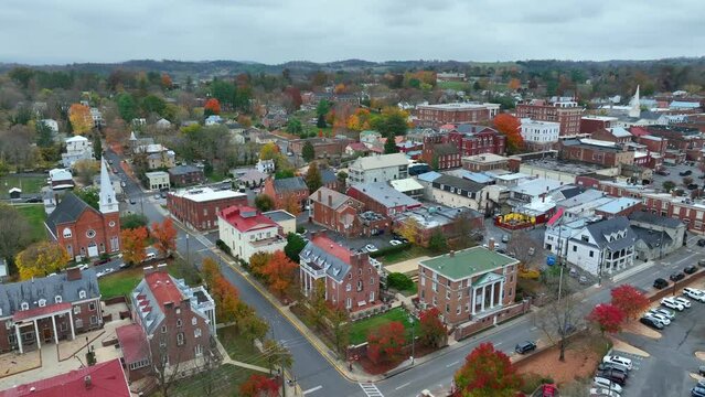 Small town America in autumn. Aerial establishing shot of Lexington, Virginia with beautiful fall foliage.