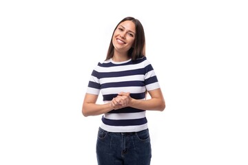 joyful young european promoter woman with black straight hair in a striped black and white t-shirt and jeans