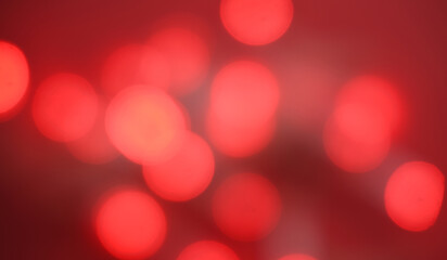 Blurred Christmas lights background with colorful red holiday bokeh