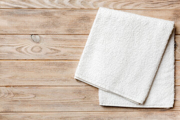 Top view of white towels with copy space on colored background