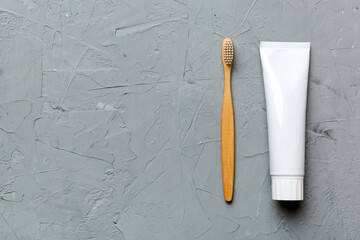 toothpaste and toothbrush top view with copy space on colored background. Flat lay. Dental hygiene....