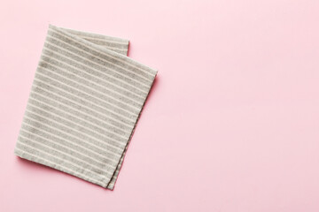 top view with gray kitchen napkin isolated on table background. Folded cloth for mockup with copy...