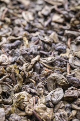 Dried natural large tea leaves close up. Tea Zhu Lu also known as Gunpowder.