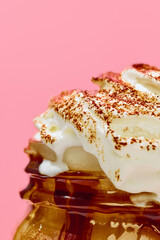 Mug with delicious sweet coffee, latter, mocha with salted caramel and whipped cream against pink background. Concept of winter season, Christmas holidays, traditional drinks, taste. Poster