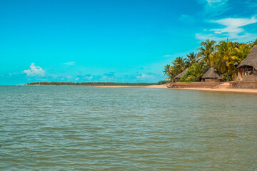 View of beach against resorts aamidst palm trees in Manda Island, Lamu Island, Kenya