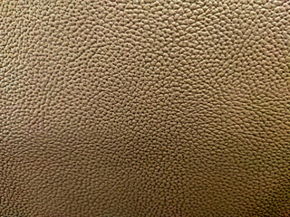 The seat texture is made of golden faux leather