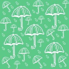 Fototapeta na wymiar various umbrellas and blue rain drops on green background