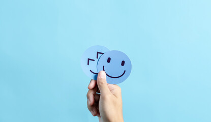 Hands holding happy smile face. mental health positive thinking and growth mindset, mental health care recovery to happiness emotion. - obrazy, fototapety, plakaty
