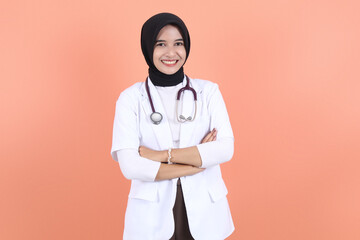 asian muslim beautiful female doctor in white coat with stethoscope, waist up. Woman hospital...