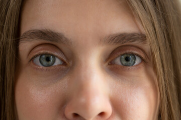 Women's eyes with long eyelashes after lamination. Close-up of the open eyes of a girl with long eyelashes. Close-up of women's eyes. 