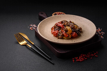 Warm salad with veal, tomatoes, peppers, zucchini, sesame, salt, spices and herbs