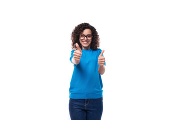 young happy woman dressed in a blue t-shirt made curly hair styling