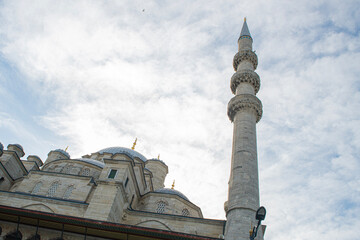 Fototapeta na wymiar Eminonu Yeni Cami or New Mosque. Islamic background photo. Ottoman mosque architecture background photo. 