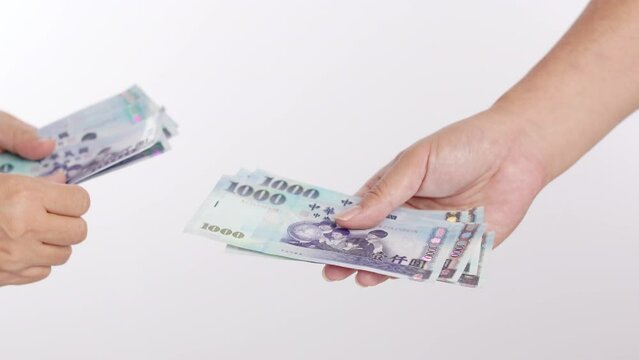 Hand counting passing New Taiwan Dollar currency  , hand giving money thousand dollar Taiwan banknotes