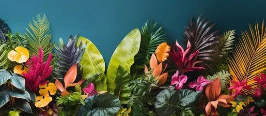  Tropical leaves and flowers background. © Sariyono