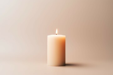 Fototapeta na wymiar Light candle on pale backdrop