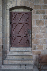 Detail of old wooden door inside Mont Saint-Michel Abbey