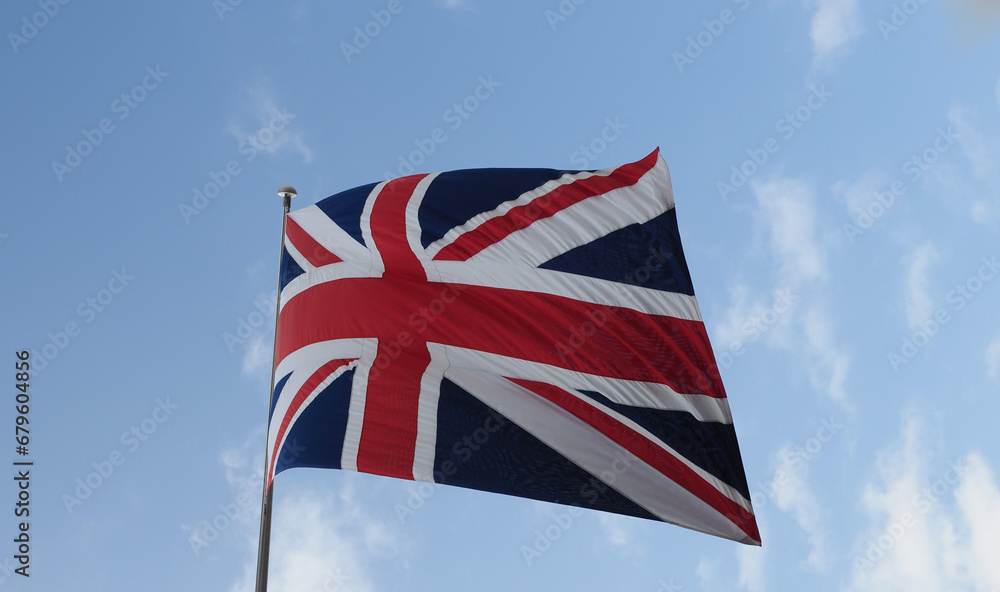 Poster Union Jack flag of the United Kingdom over blue sky