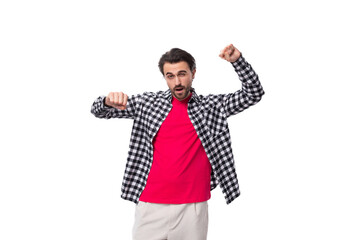 young well-groomed brunette caucasian man with a stylish hairstyle and beard on a white background