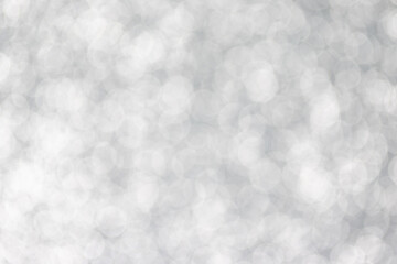 Silver sparkling bokeh. Abstract texture. Christmas background.