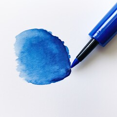the tip of a brush on a blank canvas