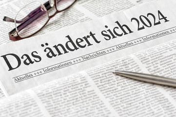 Zeitung mit der Überschrift Das ändert sich 2024 - obrazy, fototapety, plakaty