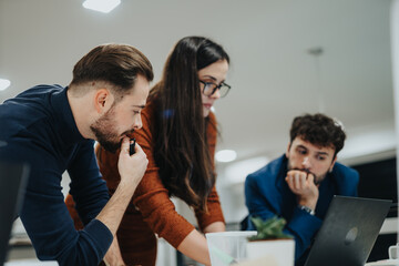 Diverse professionals in a creative office brainstorming for company growth. Late night collaboration and sharing ideas lead to success.
