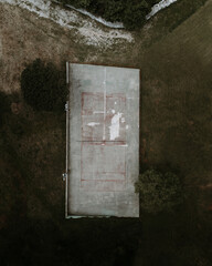 an abandoned pitch in front of an old house