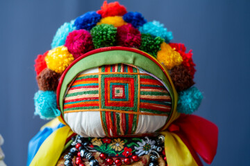 Close-up of a traditional amulet doll for sale to tourists at a street market, Kyiv, Ukraine. Ukrainian motanka dolls