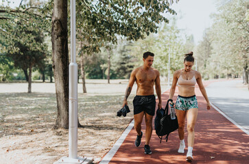 Active Couple Enjoying a Fun Conversation After Workout in the Natural Environment