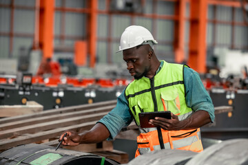 Metal sheet workers perform routine quality checking, enhancing assurance in roofing infrastructure