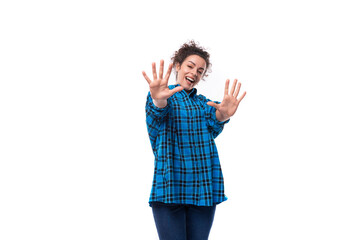 young caucasian brunette woman with hair gathered in a bun pulls her hands forward