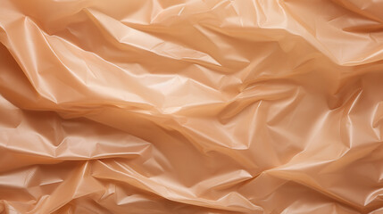 Texture of crumpled plastic wrapping on brown pastel background
