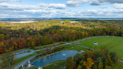 Obraz premium An Aerial View of Autumn Trees of Color Over Countryside, Sun and Shadows