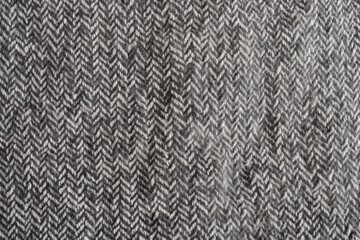 Fototapeta na wymiar gray woolen fabric texture in daylight